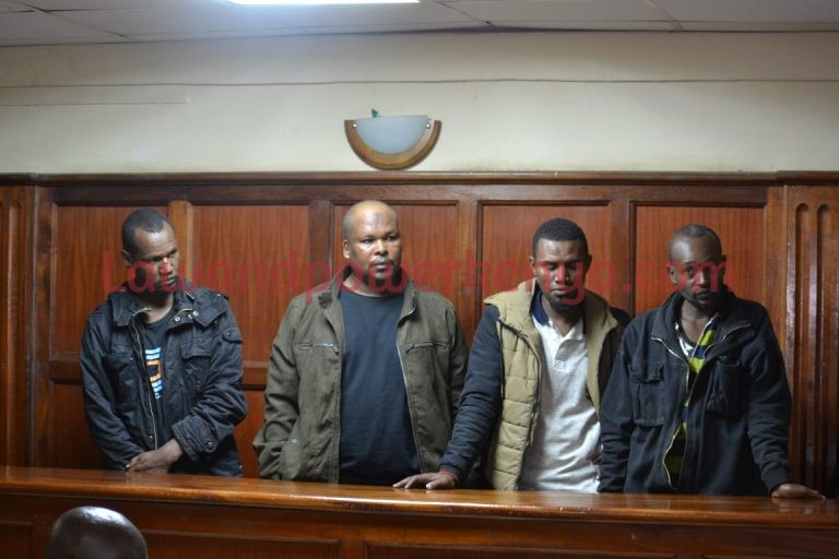 Four charged with human trafficking